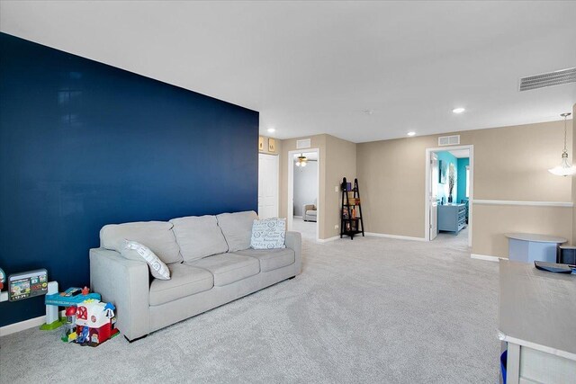 6103 Winterhaven Dr, Joliet, IL 60431 - living room featuring light carpet, baseboards, and recessed lighting