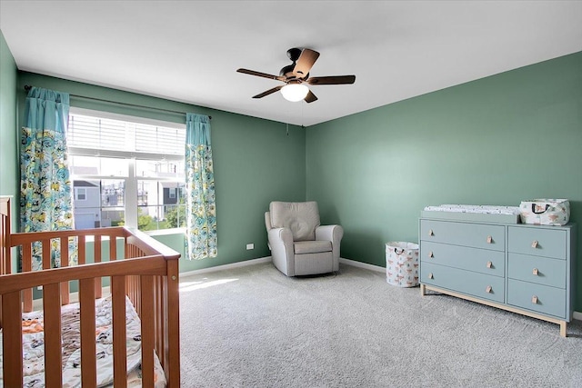 6103 Winterhaven Dr, Joliet, IL 60431 - carpeted bedroom featuring a nursery area, baseboards, and ceiling fan