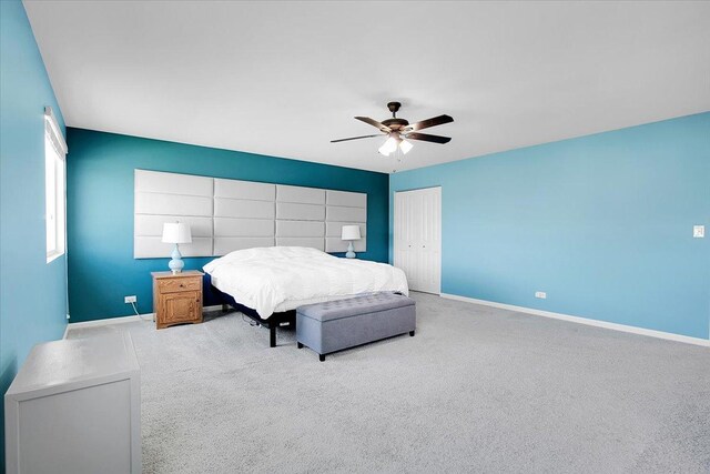 6103 Winterhaven Dr, Joliet, IL 60431 - carpeted bedroom featuring a closet, baseboards, and a ceiling fan