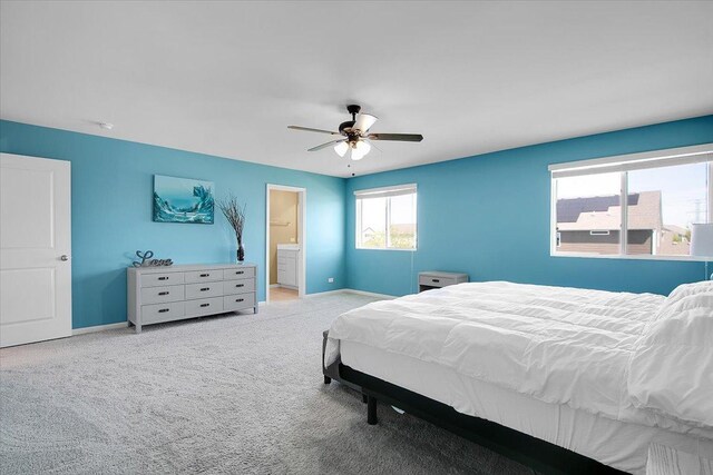 6103 Winterhaven Dr, Joliet, IL 60431 - bedroom with carpet floors, baseboards, ceiling fan, and connected bathroom
