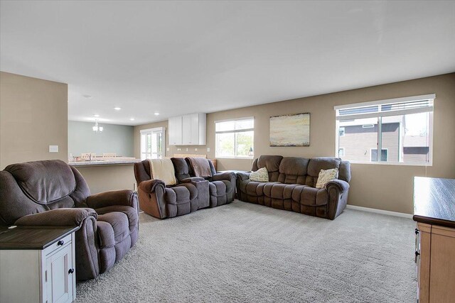 6103 Winterhaven Dr, Joliet, IL 60431 - living area with a chandelier, light colored carpet, recessed lighting, and baseboards