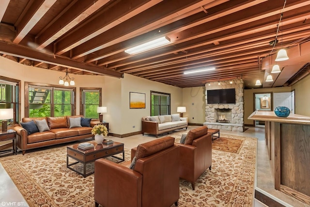 1302 Bradley Ct, Spring Grove, IL 60081 - living room with a stone fireplace and baseboards