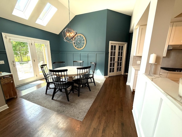 12074 Winterberry Ln, Plainfield, IL 60585 - dining space with a skylight, a chandelier, french doors, dark wood-style floors, and lofted ceiling