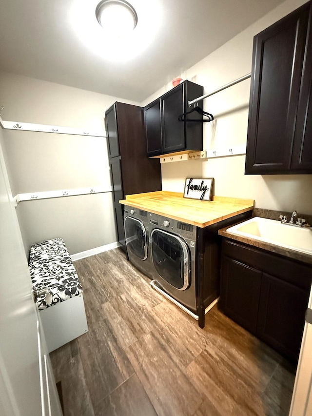 12074 Winterberry Ln, Plainfield, IL 60585 - washroom with cabinet space, washer and clothes dryer, and dark wood finished floors
