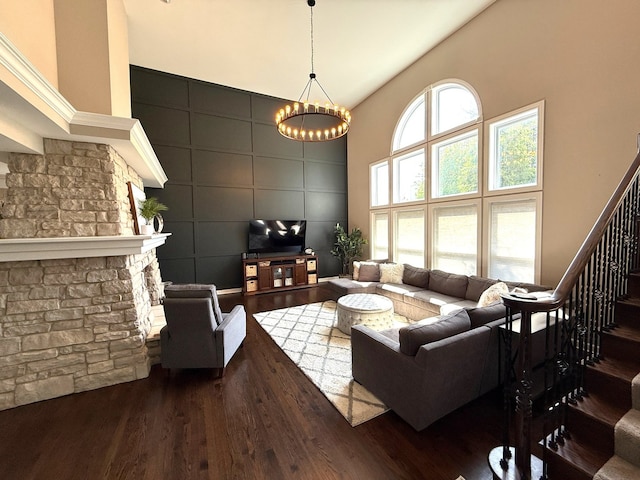 12074 Winterberry Ln, Plainfield, IL 60585 - living room featuring wood finished floors, a high ceiling, a chandelier, and stairway