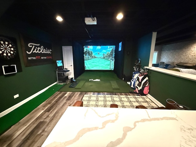 12074 Winterberry Ln, Plainfield, IL 60585 - playroom featuring golf simulator, wood finished floors, and baseboards