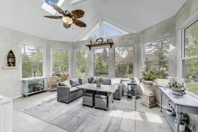 sunroom / solarium featuring a skylight, tile patterned floors, and high vaulted ceiling