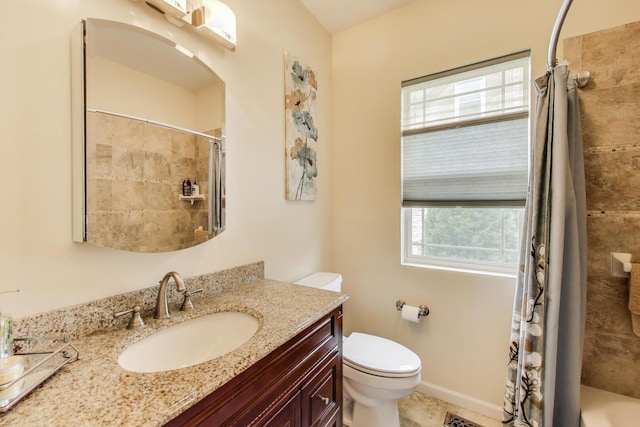 bathroom with toilet, a shower with shower curtain, and vanity