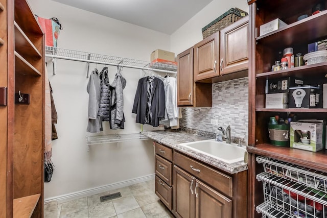spacious closet with a sink