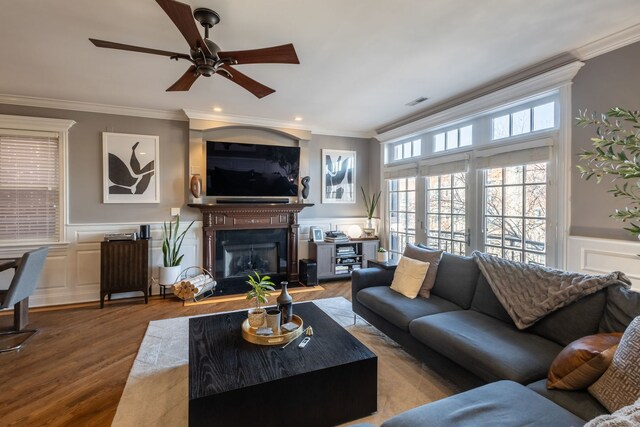 853 W Buckingham Pl Unit 4, Chicago, IL 60657 - living area with ornamental molding, ceiling fan, a decorative wall, wood finished floors, and wainscoting