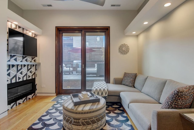 1942 N Cleveland Ave, Chicago, IL 60614 - living area featuring wood finished floors, recessed lighting, and a fireplace