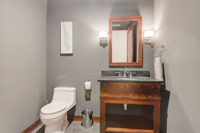 1942 N Cleveland Ave, Chicago, IL 60614 - half bathroom with toilet, baseboards, vanity, and tile patterned floors