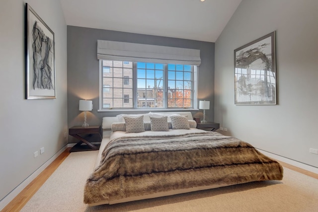 1942 N Cleveland Ave, Chicago, IL 60614 - bedroom featuring lofted ceiling, wood finished floors, and baseboards