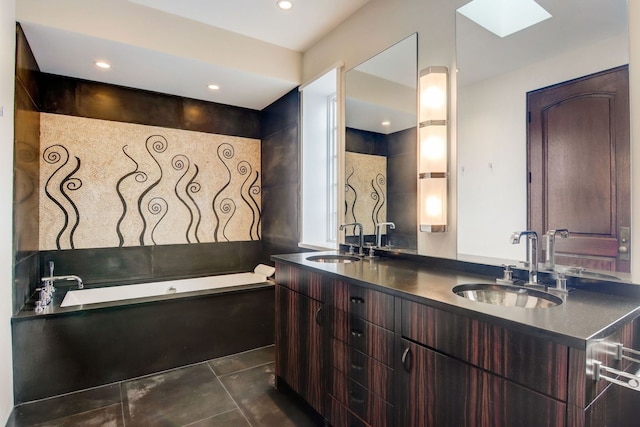 1942 N Cleveland Ave, Chicago, IL 60614 - full bath featuring a skylight, double vanity, a bath, and recessed lighting
