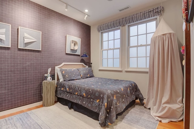 1942 N Cleveland Ave, Chicago, IL 60614 - bedroom featuring track lighting and wood finished floors