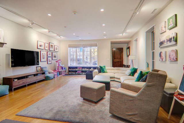 1942 N Cleveland Ave, Chicago, IL 60614 - living area with track lighting, wood finished floors, and recessed lighting