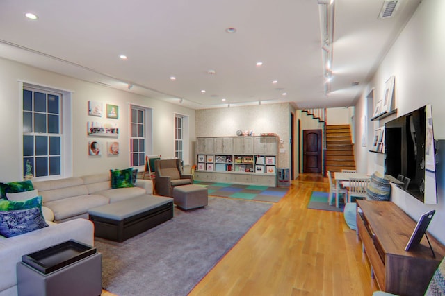1942 N Cleveland Ave, Chicago, IL 60614 - living room with track lighting, wood finished floors, stairs, and recessed lighting