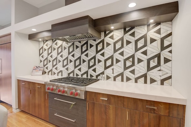 1942 N Cleveland Ave, Chicago, IL 60614 - kitchen featuring stainless steel gas cooktop, light countertops, tasteful backsplash, light wood-style flooring, and recessed lighting