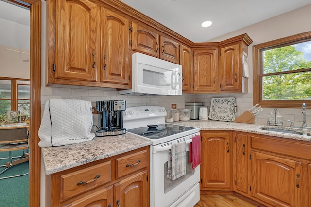 1002 Birchwood Ct, Morris, IL 60450 - kitchen featuring white appliances, a sink, decorative backsplash, brown cabinetry, and recessed lighting