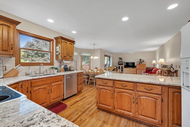 1002 Birchwood Ct, Morris, IL 60450 - kitchen featuring dishwasher, a sink, light wood-style flooring, decorative backsplash, and brown cabinetry