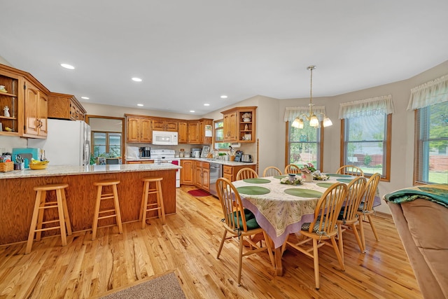 1002 Birchwood Ct, Morris, IL 60450 - dining space with light wood-style flooring, a chandelier, and recessed lighting