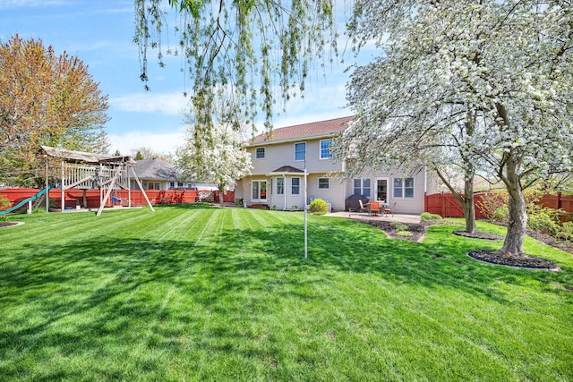 1002 Birchwood Ct, Morris, IL 60450 - back of property with a playground and a patio