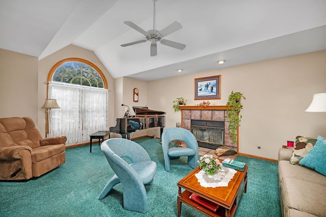 1002 Birchwood Ct, Morris, IL 60450 - living area featuring carpet, lofted ceiling, a tile fireplace, a ceiling fan, and baseboards