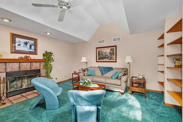 1002 Birchwood Ct, Morris, IL 60450 - living room featuring baseboards, vaulted ceiling, a ceiling fan, carpet flooring, and a fireplace