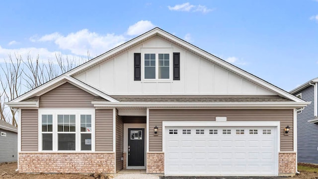2611 Harnish Dr, Algonquin, IL 60102 - craftsman-style house featuring board and batten siding, driveway, a garage, and brick siding