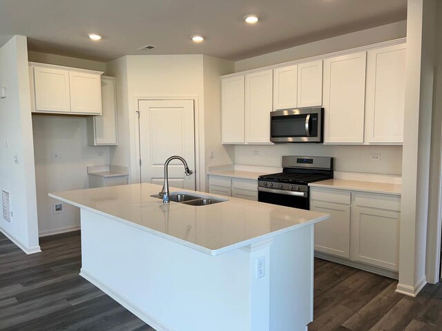 2611 Harnish Dr, Algonquin, IL 60102 - kitchen featuring appliances with stainless steel finishes, a sink, dark wood-style flooring, recessed lighting, and a kitchen island with sink