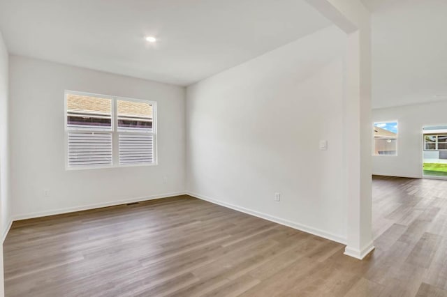 2611 Harnish Dr, Algonquin, IL 60102 - spare room with wood finished floors, plenty of natural light, and baseboards