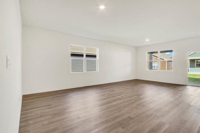 2611 Harnish Dr, Algonquin, IL 60102 - empty room with wood finished floors, baseboards, and recessed lighting