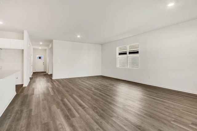 2611 Harnish Dr, Algonquin, IL 60102 - unfurnished living room featuring recessed lighting, dark wood-type flooring, and baseboards