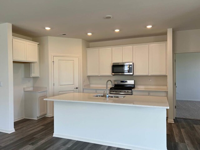 2611 Harnish Dr, Algonquin, IL 60102 - kitchen with appliances with stainless steel finishes, a sink, dark wood-style flooring, white cabinetry, and recessed lighting