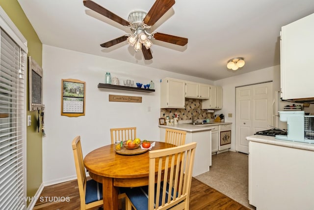 220 Wethington Dr Unit B, Wauconda, IL 60084 - dining space with ceiling fan, dark wood-style floors, and baseboards