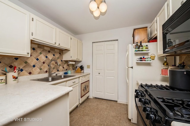 220 Wethington Dr Unit B, Wauconda, IL 60084 - kitchen with a sink, black appliances, backsplash, light countertops, and white cabinetry