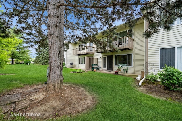 220 Wethington Dr Unit B, Wauconda, IL 60084 - rear view of house featuring a balcony, a yard, and a patio area