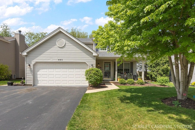 485 Mayfield Ln, Aurora, IL 60504 - view of front of home featuring driveway, a garage, a front lawn, and covered porch