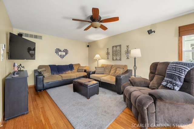 485 Mayfield Ln, Aurora, IL 60504 - living area with ceiling fan and light wood-style flooring
