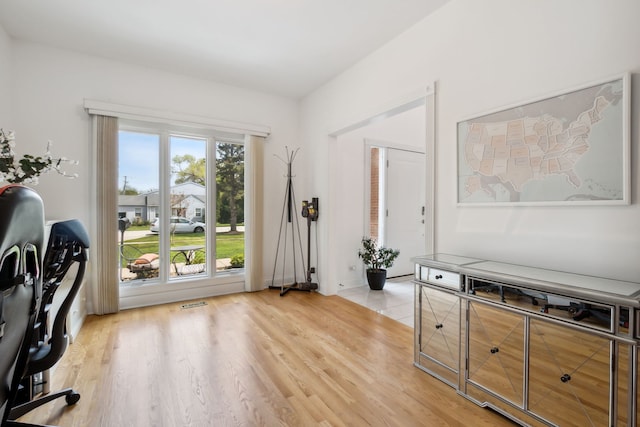 office space with light wood-type flooring