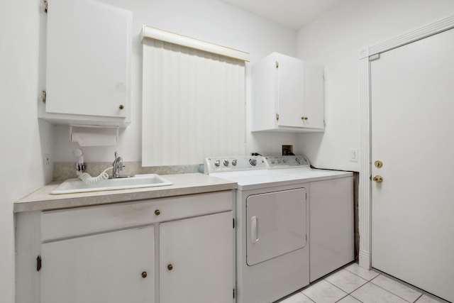 laundry room with cabinet space, washing machine and dryer, and light tile patterned flooring
