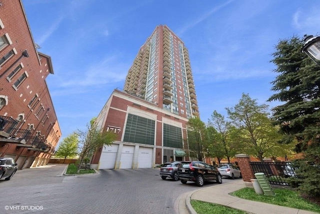1717 S Prairie Ave Unit 1902, Chicago, IL 60616 - view of building exterior featuring a garage and driveway