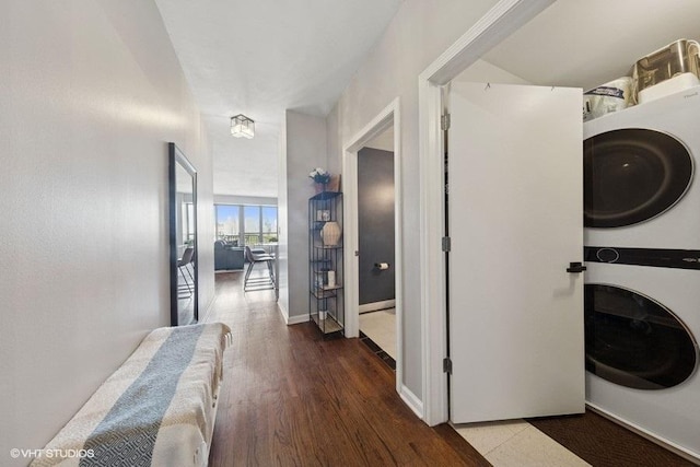 1717 S Prairie Ave Unit 1902, Chicago, IL 60616 - laundry area with stacked washer and clothes dryer, wood finished floors, and baseboards