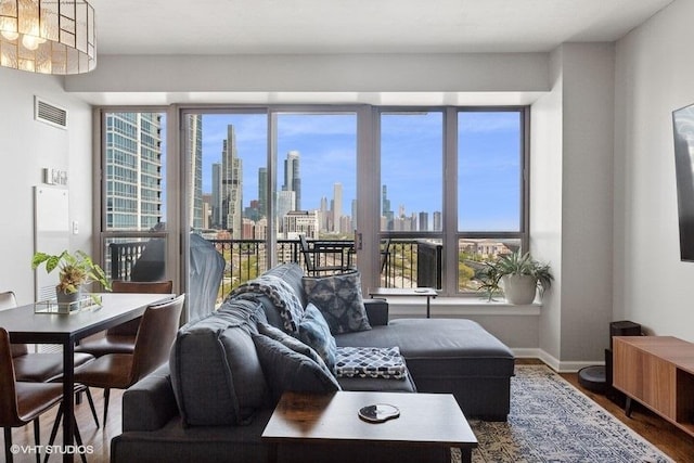 1717 S Prairie Ave Unit 1902, Chicago, IL 60616 - living room with a skyline view, wood finished floors, plenty of natural light, and baseboards