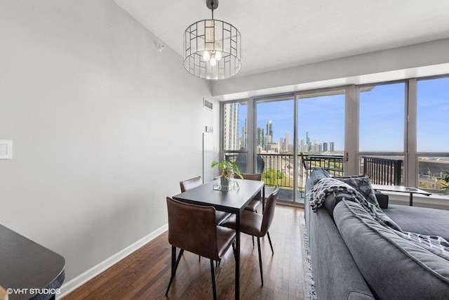 1717 S Prairie Ave Unit 1902, Chicago, IL 60616 - dining area featuring baseboards, dark wood-type flooring, and a skyline view