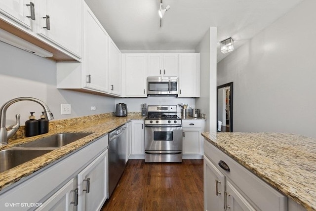 1717 S Prairie Ave Unit 1902, Chicago, IL 60616 - kitchen featuring stainless steel appliances, a sink, dark wood-style flooring, white cabinetry, and light stone counters