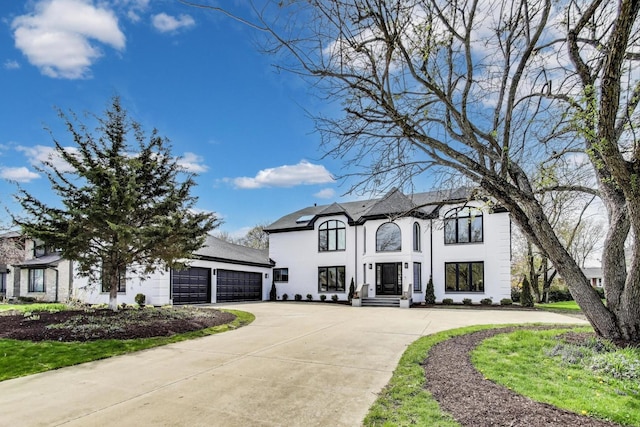 2128 Scotch Pine Ln, Northbrook, IL 60062 - french country home featuring driveway, stucco siding, and a garage