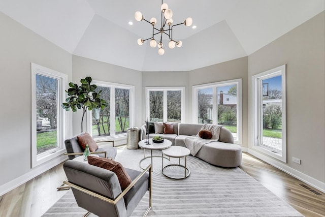 2128 Scotch Pine Ln, Northbrook, IL 60062 - living room featuring plenty of natural light, a chandelier, wood finished floors, baseboards, and a high ceiling