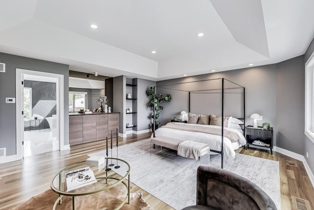 2128 Scotch Pine Ln, Northbrook, IL 60062 - bedroom featuring wood finished floors, baseboards, a tray ceiling, and recessed lighting