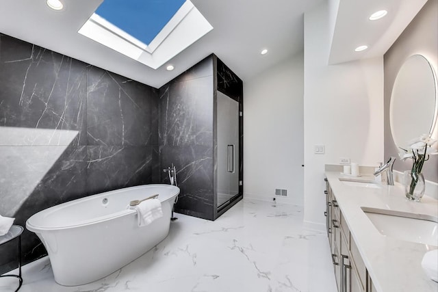 2128 Scotch Pine Ln, Northbrook, IL 60062 - bathroom featuring recessed lighting, a skylight, marble tiled flooring, a soaking tub, and double vanity